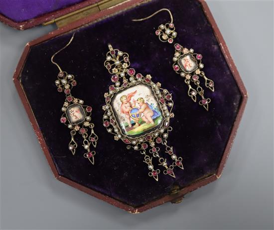 A 19th century Austro-Hungarian gilt metal, enamel, garnet and seed pearl set drop pendant brooch and pair of matching earrings.